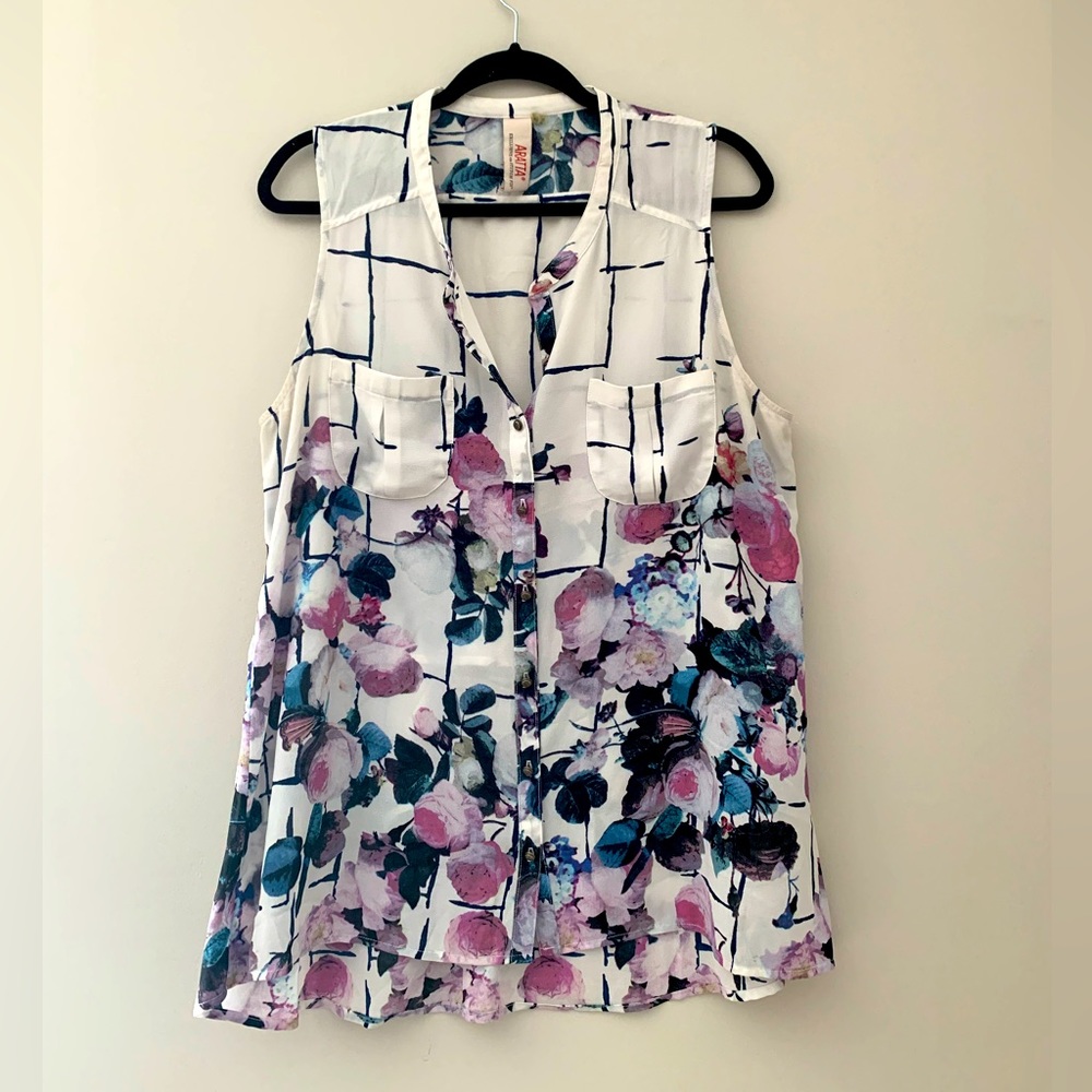 Floral collared button down tank. Unique back detail.